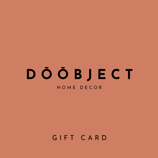 A flat terracotta orange card with centered black text reading 'DŌOBJECT HOME DECOR' and 'GIFT CARD' below, indicating a gift card product.