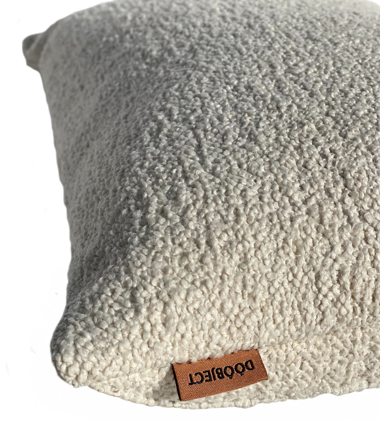 Close up boucle pillow view with logo in whiteshot 